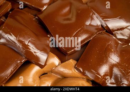 mixed together different types of chocolate, white, bitter and milk chocolate pieces Stock Photo