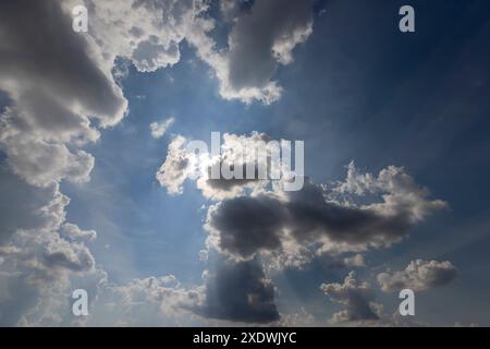 blue sky with clouds through a purple filter, partially colored purple sky with clouds Stock Photo