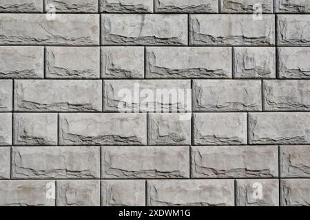 Background of huge gray concrete blocks. Retaining wall blocks. Stock Photo
