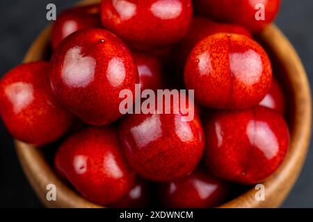 delicious sweet cherries on a slate board, delicious picked and pure cherry berries with pits Stock Photo