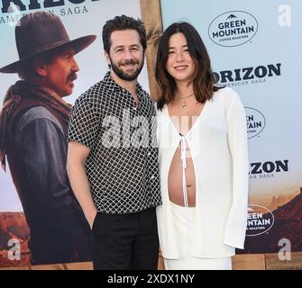 Westwood, USA. 24th June, 2024. Michael Angarano and Maya Erskine arriving to the “Horizon: An American Saga Chapter 1” Los Angeles premiere held at the Regency Village Theatre on June 24, 2024 in Westwood, Ca. © Lisa OConnor/AFF-USA.com Credit: AFF/Alamy Live News Stock Photo