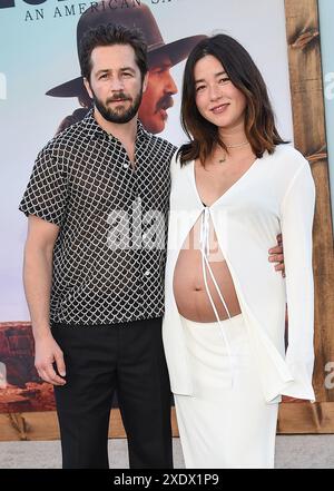 Westwood, USA. 24th June, 2024. Michael Angarano and Maya Erskine arriving to the “Horizon: An American Saga Chapter 1” Los Angeles premiere held at the Regency Village Theatre on June 24, 2024 in Westwood, Ca. © Lisa OConnor/AFF-USA.com Credit: AFF/Alamy Live News Stock Photo