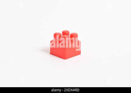 Red Plastic toy blocks isolated on white background. Building Blocks Stock Photo