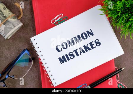 Common Mistakes, business motivational inspirational quotes, words COMMON MISTAKES in the manager's address book Stock Photo