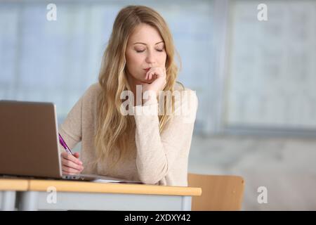 Young female student with laptop at campus Stock Photo
