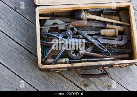 The metal tools in the old suitcase Stock Photo