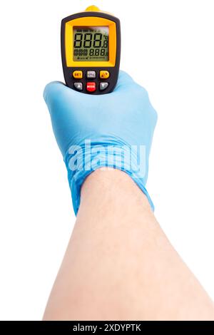Right hand in blue medical latex glove aiming with yellow infrared contactless thermometer isolated on white, mockup display sta Stock Photo