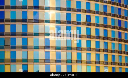 Glass facade modern building. Bright golden colors. Background image Stock Photo
