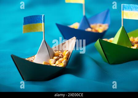 Ships with Ukrainian maize grain made of paper concept Stock Photo