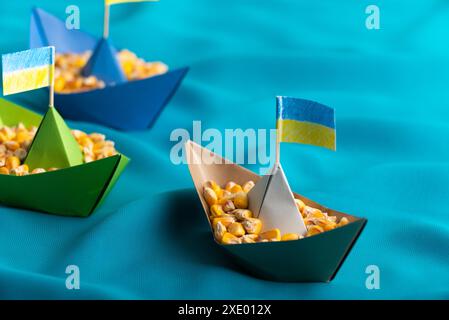 Ships with Ukrainian maize grain made of paper concept Stock Photo