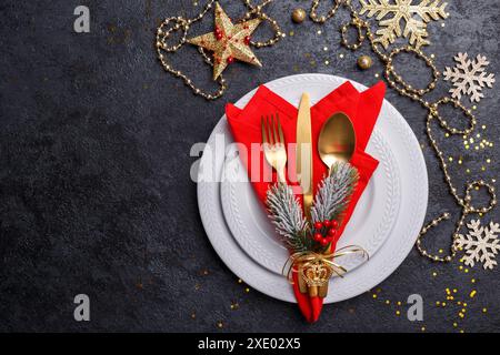 Christmas or new year table setting with golden cutlery Stock Photo