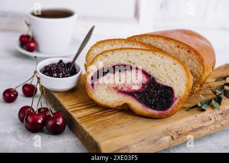 Homemade sweet cherry loaf cake on board Stock Photo