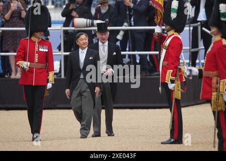 King Charles III (centre) and Emperor Naruhito inspect the guard during the ceremonial welcome at Horse Guards Parade, London, for the state visit to the UK of the Emperor and his wife Empress Masako. Picture date: Tuesday June 25, 2024. Stock Photo