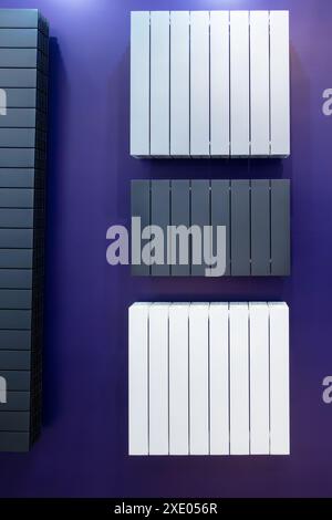 Flat wall radiators of heating gray and white. Stock Photo