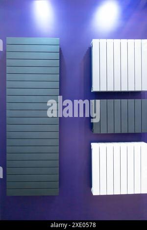 Flat wall radiators of heating gray and white. Stock Photo