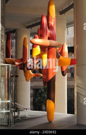 Day In, Day Out, large colourful sculpture by artist, James Angus in dappled sunlight in the open entrance portico to 1 Bligh St in Sydney’s CBD Stock Photo