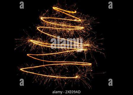 Zigzag sparklers on a black background Stock Photo