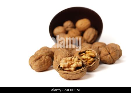 Walnuts in a brown bowl Stock Photo
