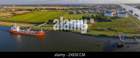 Aerial view of oil tankers moored at an oil storage silo terminal of chemical plant.Drone view of in Stock Photo