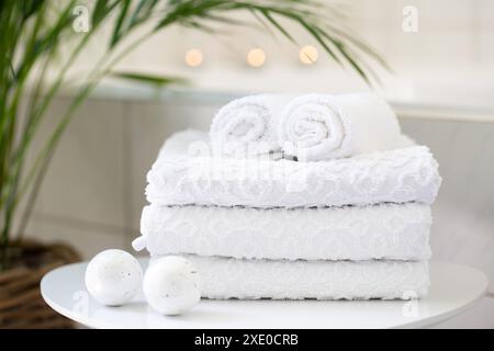 Rolled white towels in the bathroom Stock Photo