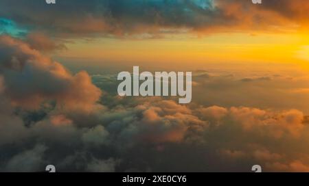 Clouds over sea in sunset colors Stock Photo