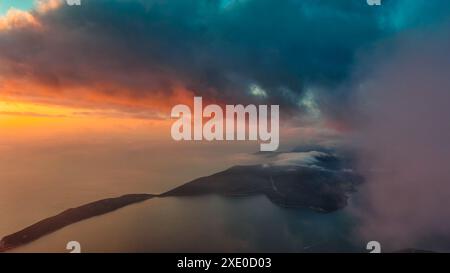 Dramatic sunset clouds over sea Stock Photo