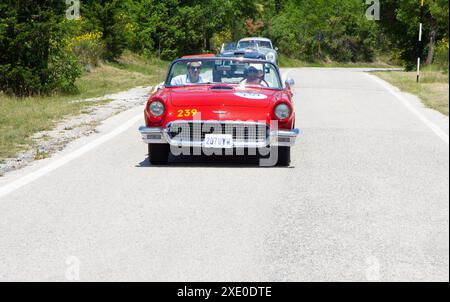 FORD THUNDERBIRD 1957 on an old racing car in rally Mille Miglia 2022 the famous italian historical race Stock Photo