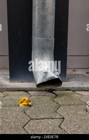 Rain gutter in front of a house wall Stock Photo