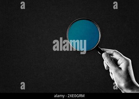 Hand in Black and White Holding Magnifying Glass, Copy Space Stock Photo