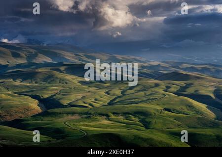 Sunset on hills in Caucasus mountains Stock Photo