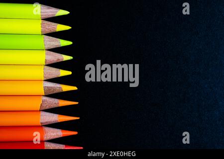 Pencils on black canvas Stock Photo