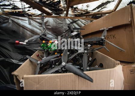 FPV drones with explosives attached to them are seen inside a bunker used by the 92nd Brigade, known as the "Achilles" Brigade, at a position about 10 kilometers from the Russian border in Kharkiv Oblast, Ukraine. First Person View (FPV) drones have changed the nature of warfare in Ukraine, with both Ukrainian and Russian forces coming to rely on these drones, which are armed with explosives and remotely controlled by a pilot wearing a headset. (Photo by Laurel Chor / SOPA Images/Sipa USA) Stock Photo