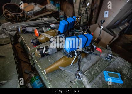 FPV drones with explosives attached to them are seen inside a bunker used by the 92nd Brigade, known as the "Achilles" Brigade, at a position about 10 kilometers from the Russian border in Kharkiv Oblast, Ukraine. First Person View (FPV) drones have changed the nature of warfare in Ukraine, with both Ukrainian and Russian forces coming to rely on these drones, which are armed with explosives and remotely controlled by a pilot wearing a headset. (Photo by Laurel Chor / SOPA Images/Sipa USA) Stock Photo
