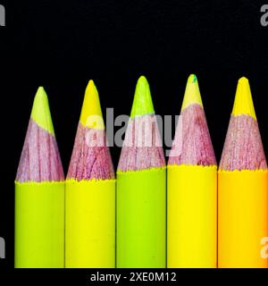 Yellow pencils on black ground Stock Photo
