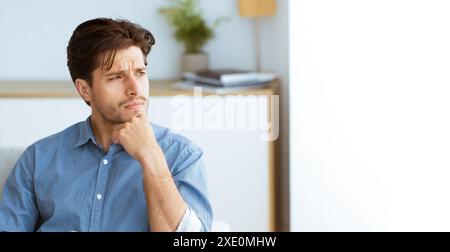 Man Thinking in a Room Stock Photo