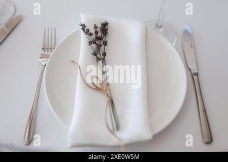 Elegant wedding plate decorations made of natural flowers Stock Photo