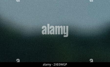 Dark gray-bluish gradient, soft abstract bokeh background, rough texture, grainy noise. Stock Photo