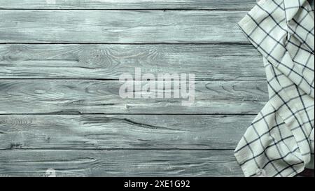 Gray wooden table with kitchen napkin, flat lay Stock Photo