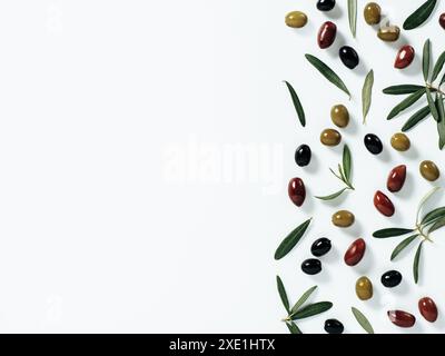 Olives fruits mix and olive branches, copy space Stock Photo