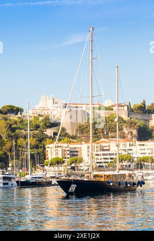 Monte Carlo, Monaco - Port Hercule with luxury yachts,  boats, and scenery skyline Stock Photo