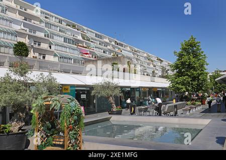 The Brunswick Centre, London, UK. Famous, 1960s brutalist housing development on Brunswick Square, Bloomsbury. Central shopping courtyard. Stock Photo