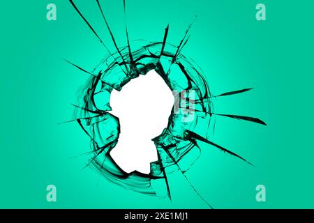 A hole in green glass. Broken window with cracks texture, effect for design solutions. Stock Photo