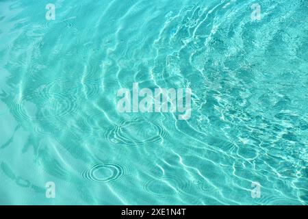 Teal blue water ripples in pool Stock Photo