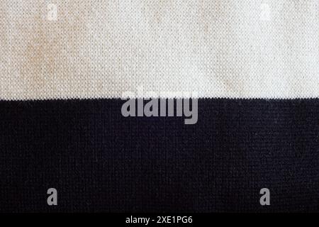 The intricate weave detail of this fabric texture of cotton, polyester and polyamide exemplifies the harmony between light and shadow make a versatile Stock Photo
