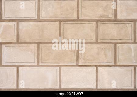 Background from a wall with rectangular beige stone slabs Stock Photo