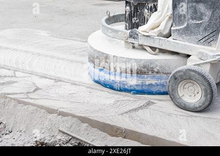 Grinding machine working on Concrete city road on construction site Stock Photo