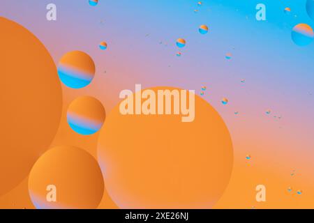 Colorful circles floating on a gradient background Stock Photo