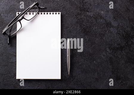 Blank notepad with pen Blank notepad with penBlank notepad with pen and glasses Blank notepad with pen Stock Photo