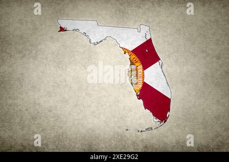 Grunge map of the state of Florida (USA) with its flag printed within its border on an old paper. Stock Photo