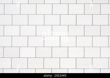Background from a wall with rectangular white stone slabs Stock Photo